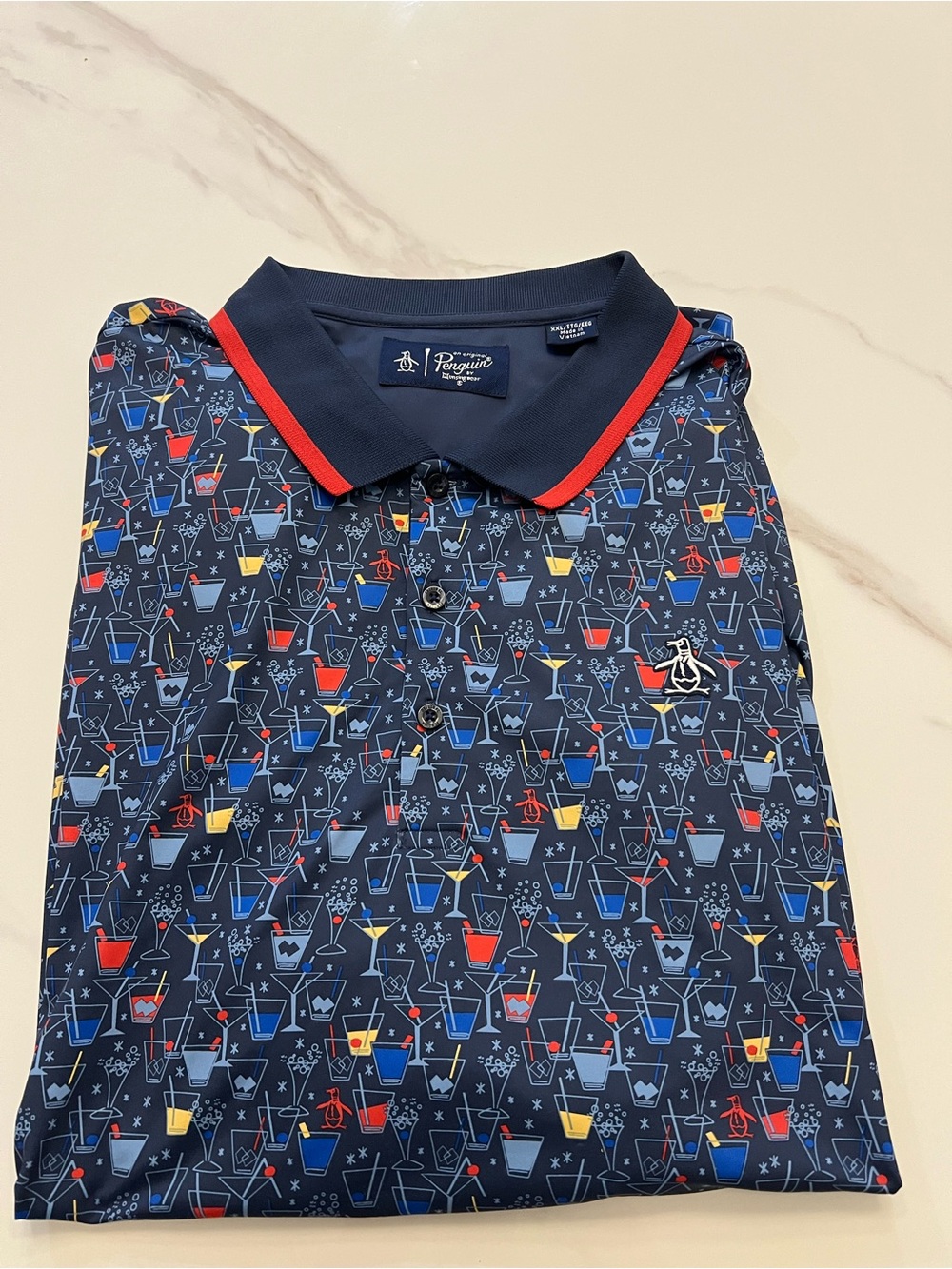 Original Penguin Navy Polo with Red, Blue, and Yellow Cocktail Print